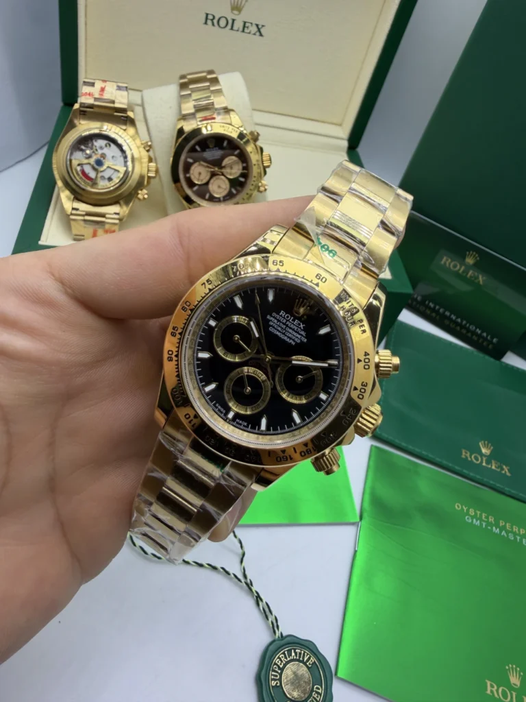 Daytona 40mm - AÇO DOURADO MOSTRADOR PRETO - FUNDO DE VIDRO