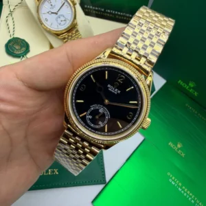 Perpetual 1908 - 40mm - AÇO DOURADO MOSTRADOR PRETO - FUNDO DE VIDRO