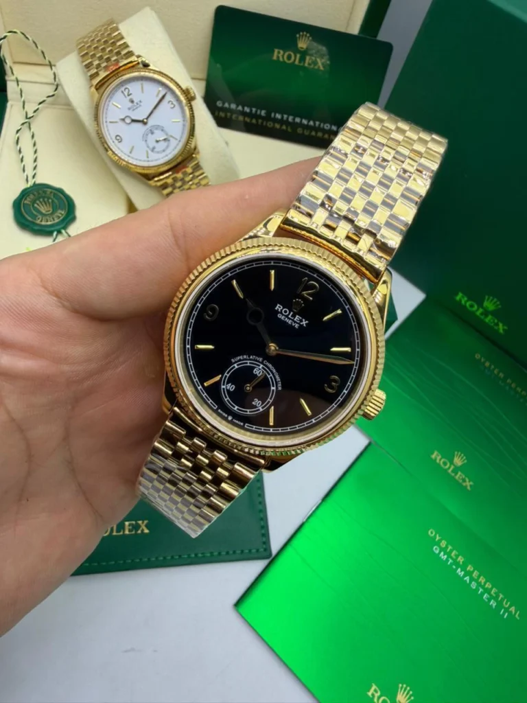 Perpetual 1908 - 40mm - AÇO DOURADO MOSTRADOR PRETO - FUNDO DE VIDRO